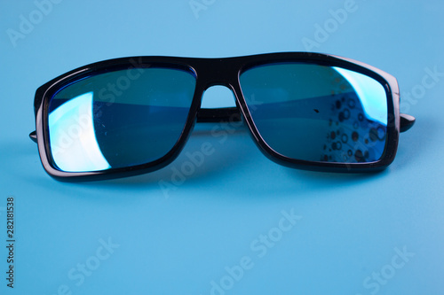 Glasses on blue background