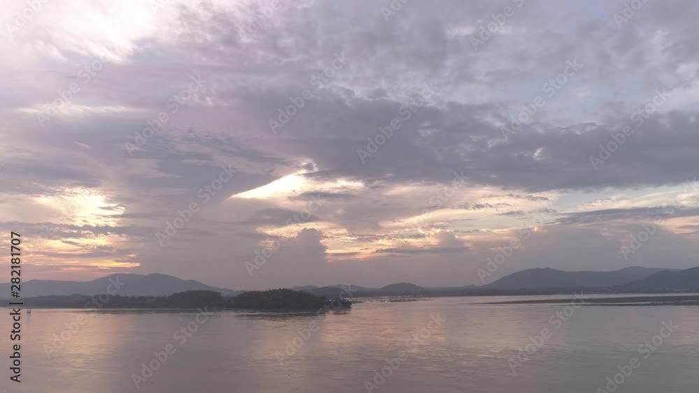 Aerial view of a huge river with yellow and white cloud sky in Assam, India Aerial view of a huge river with yellow and white cloud sky in Assam, India