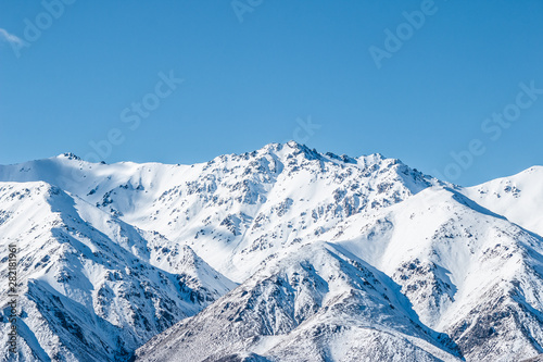 mountains in winter, snow capped peaks, mountain winter landscape © Joshua
