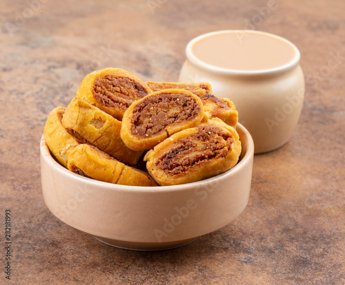 Indian Traditional Spicy Snack Bhakarwadi Also Know as Bakarwadi, Bakarvadi, Bakar Vadi or Bakar Wadi Are Deep Fried Snack Made From Chickpea Flour photo