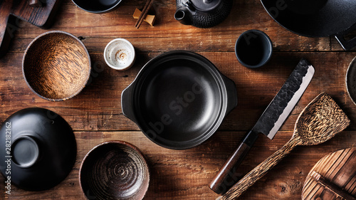 Fotografie Set of dishes for Asian cuisine, pot, bowls, wok, Japanese knife, top view