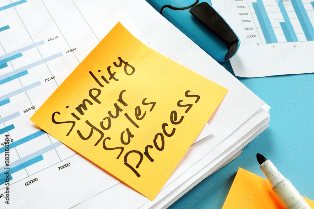 Simplify Your Sales Process written on the page. - obrazy, fototapety, plakaty 
