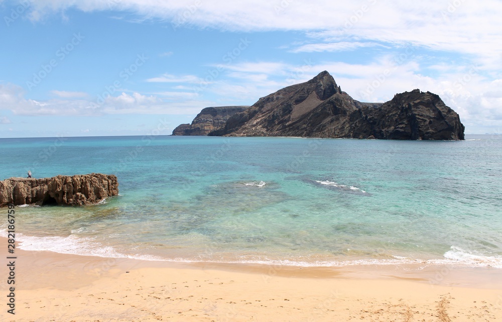 Porto Santo warm bright waters, near Islet of Cal, Calheta beach, at the SW most point of this calm Portuguese island. Cristiano Ronaldo planned to build a 5 stars resort here, not far from Madeira.