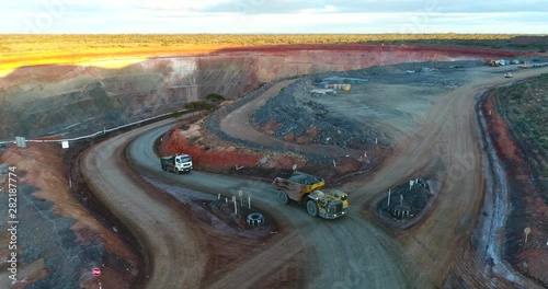 Trucks working on a gold mine photo