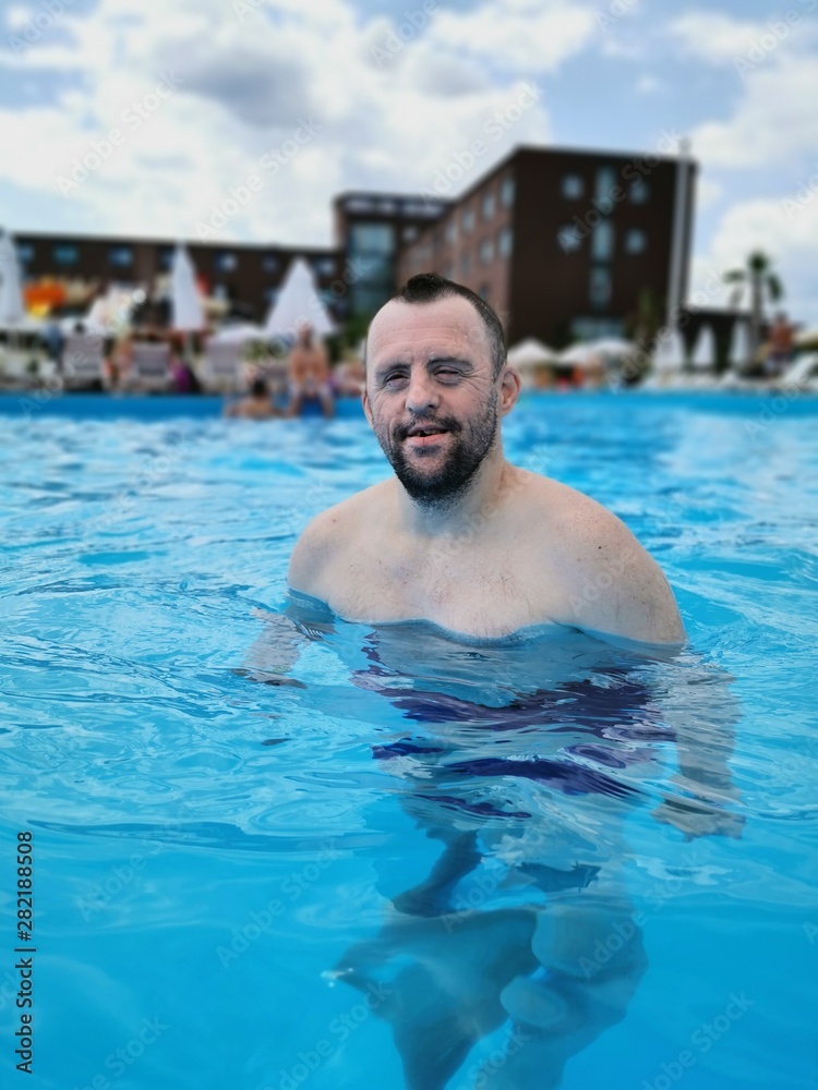 handicapped boy in swimming pool.