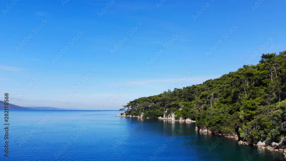 A scenic, steady aerial view of Gulf of Gokova coastline (the Aegean Sea) on a bright summer day. A scenic, steady aerial view of Gulf of Gokova coastline (the Aegean Sea) on a bright summer day.