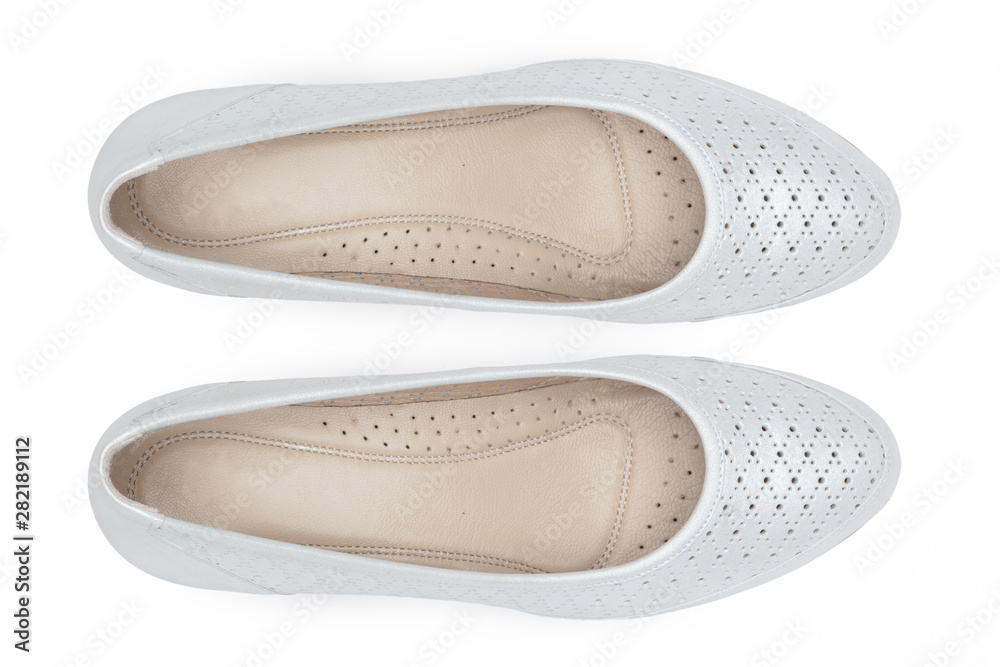 Female shoes on a white background. Top view. Female shoes on a white background. Top view.