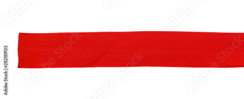 Top view close up of  red ribbon isolated on white background. Flat lay