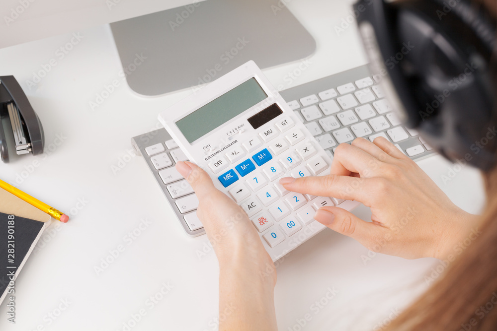 woman hands working with calculator close up woman hands working with calculator close up