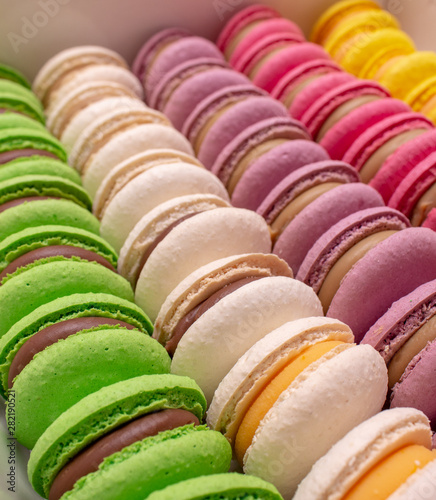 Bright colored macaroons. Lots of pieces. Side view