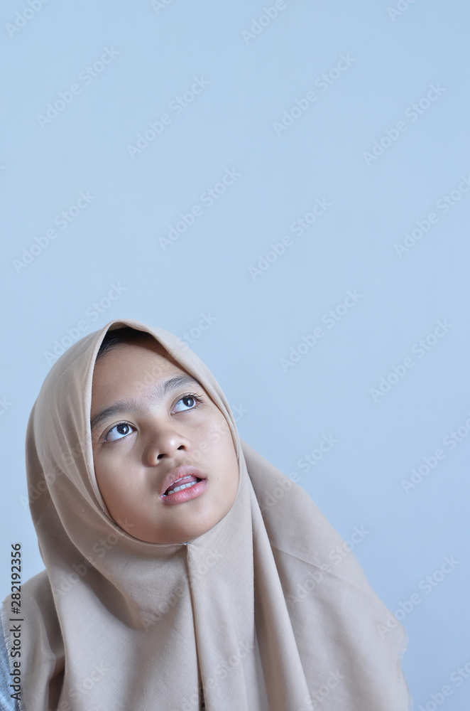 Portrait of a young muslim woman look at blank area for sign or copyspace Portrait of a young muslim woman look at blank area for sign or copyspace