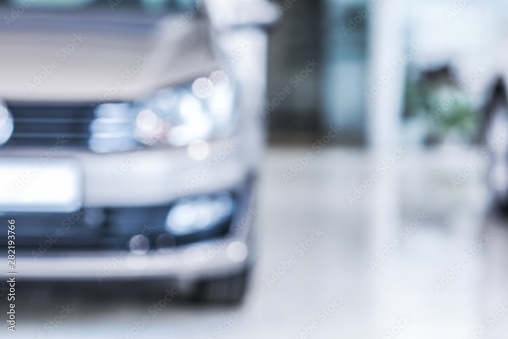 Modern car in showroom, blurred view Modern car in showroom, blurred view