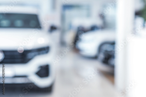 Blurred interior of modern car showroom © Pixel-Shot