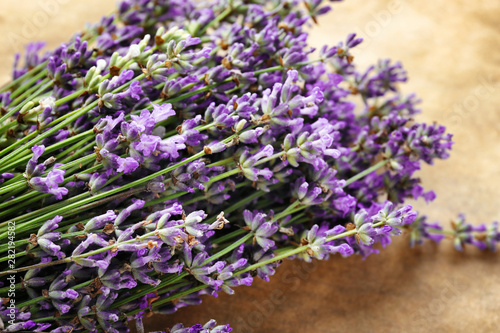Beautiful lavender flowers on parchment  closeup