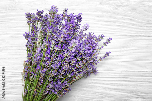 Beautiful lavender flowers on white wooden background