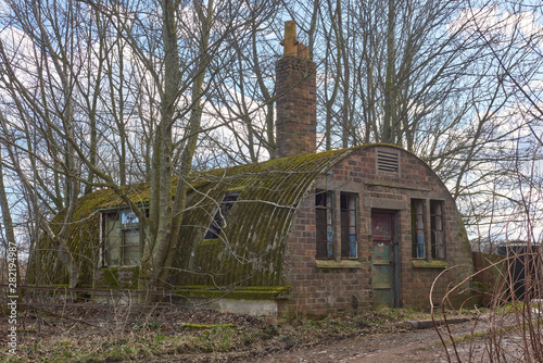 One of the few Airfield Nissan huts still standing near RN Condor in Arbroath, although this one is hidden away in a copse of Trees, and can be barely seen in Summer. photo