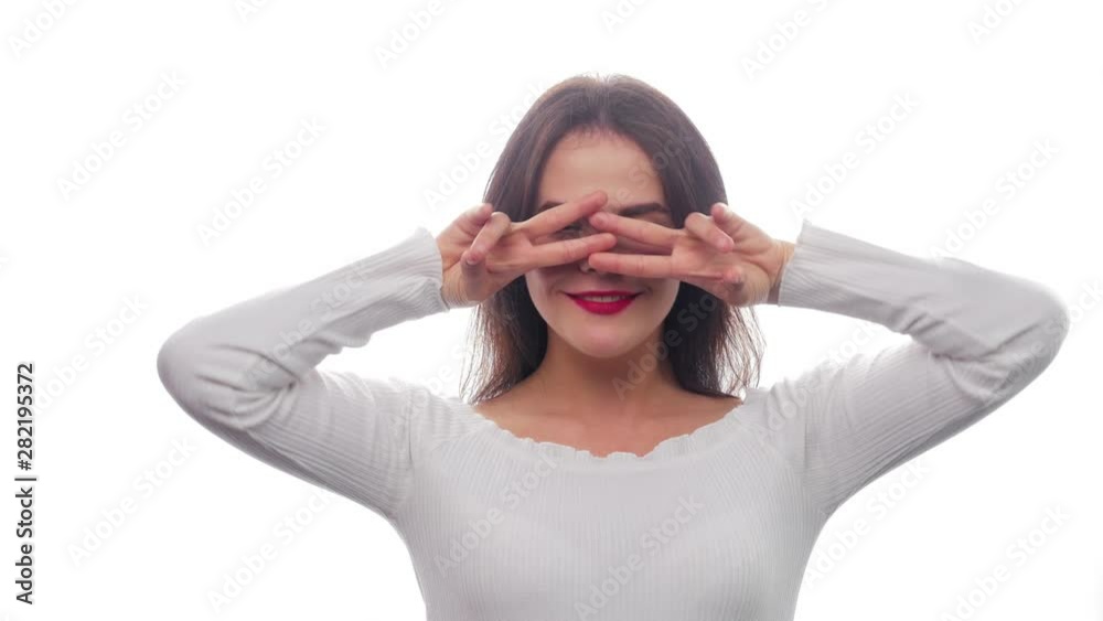 Beautiful cute girl fooling around, covering her face with hands - White Background - Face Expressions Beautiful cute girl fooling around, covering her face with hands - White Background - Face Expressions