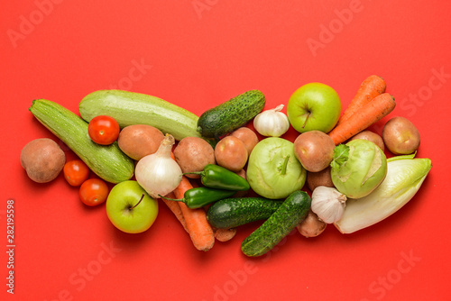 Assortment of fresh vegetables on color background