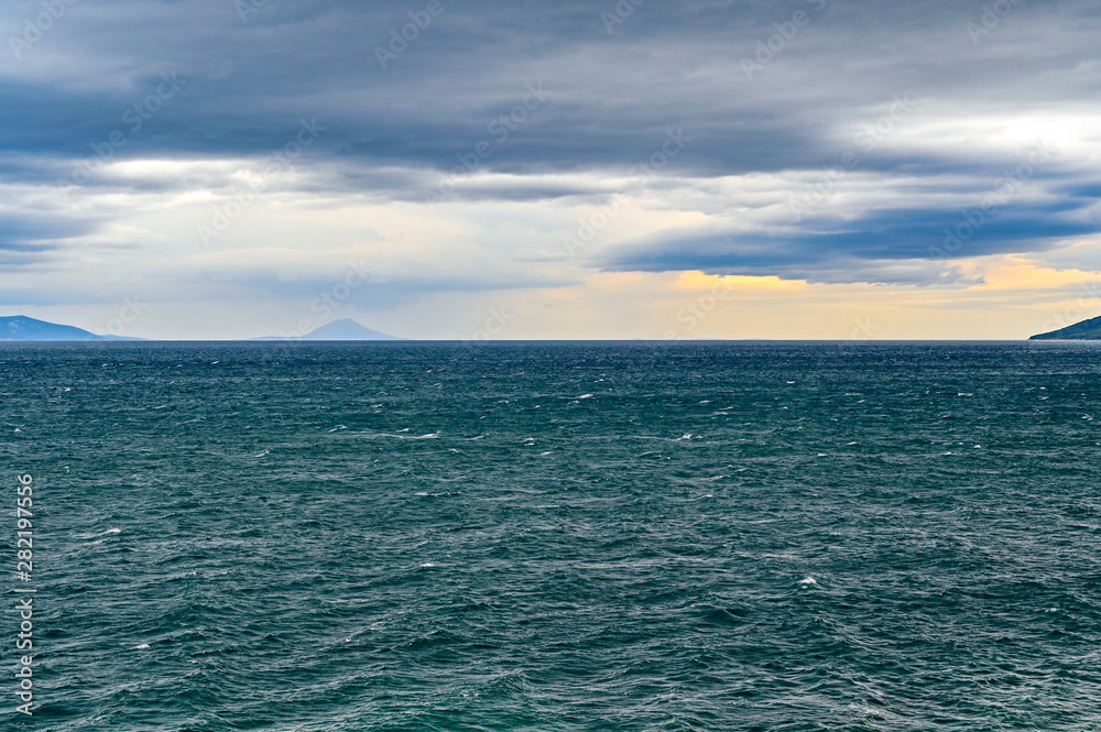 a dark adriatic sea and a cloudy sky