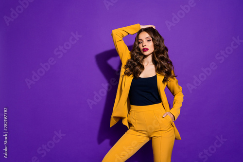 Photo of flawless chic woman whom no man can approach being isolated with purple background