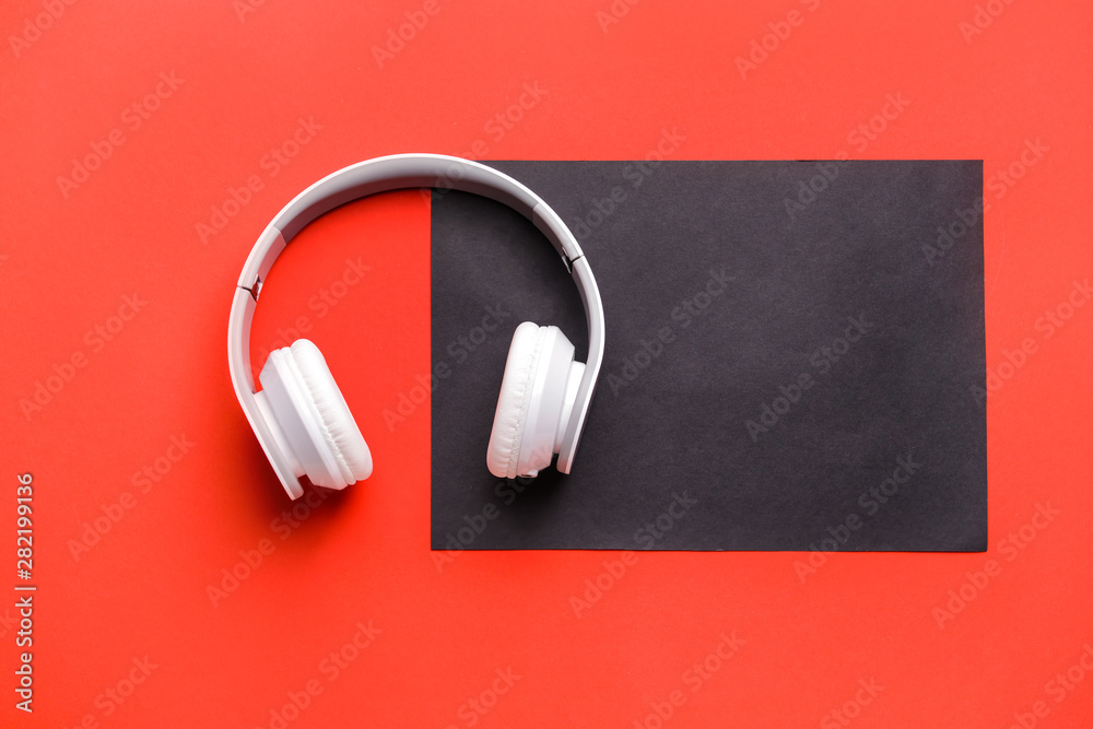 Modern headphones on color background Modern headphones on color background