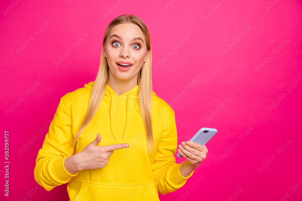 Pretty lady holding telephone hands excited sale price wear yellow hoodie pullover isolated pink background Pretty lady holding telephone hands excited sale price wear yellow hoodie pullover isolated pink background