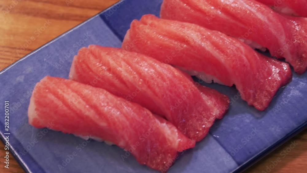 Japanese cuisine. A tuna fillet sushi on plate Japanese cuisine. A tuna fillet sushi on plate