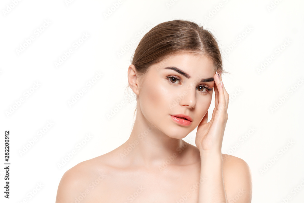 Close-up portrait of a beautiful young girl with holding hands near face isolated over white background.