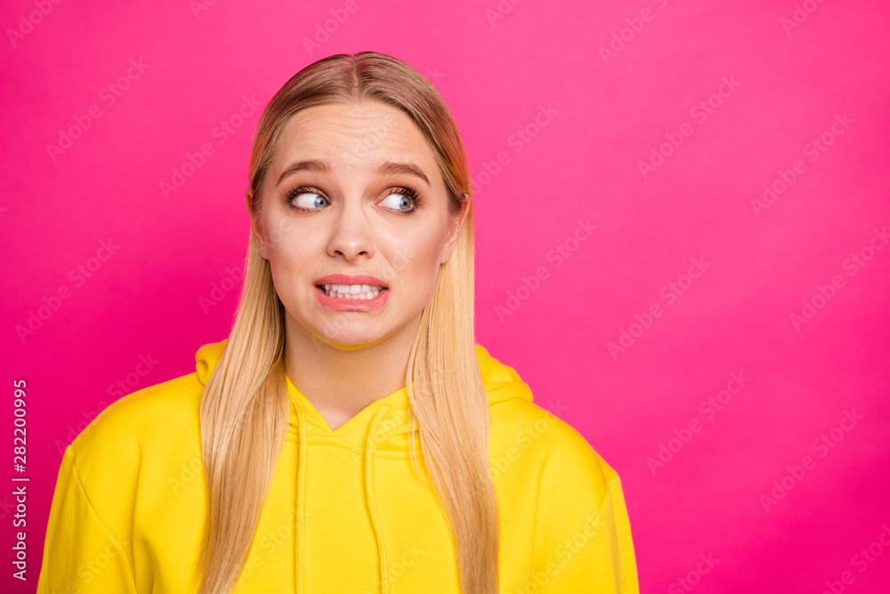 Closeup photo of pretty lady feel guilty wear yellow hoodie pullover isolated pink background Closeup photo of pretty lady feel guilty wear yellow hoodie pullover isolated pink background