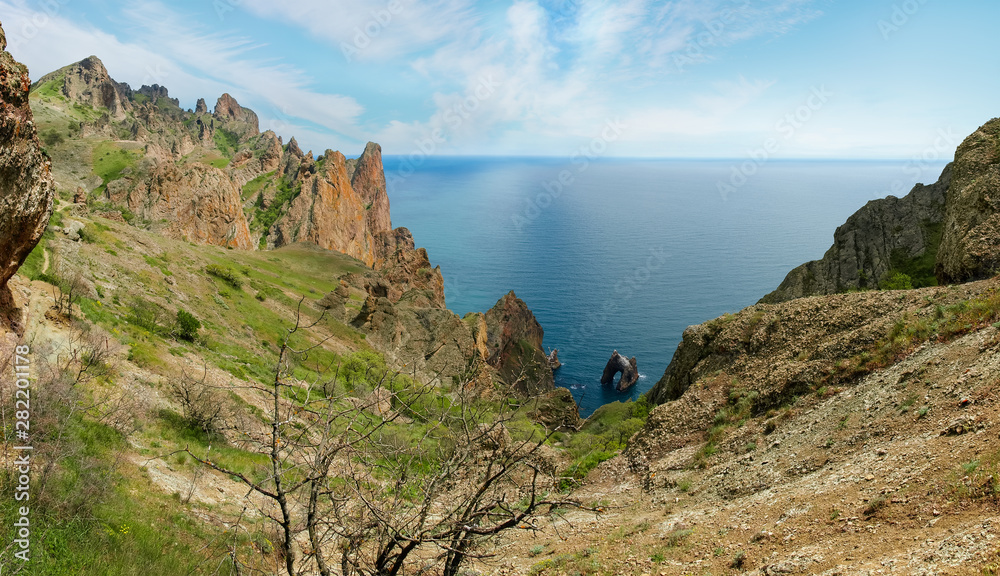 Fototapeta premium Coastal cliffs of volcanic origin above the sea