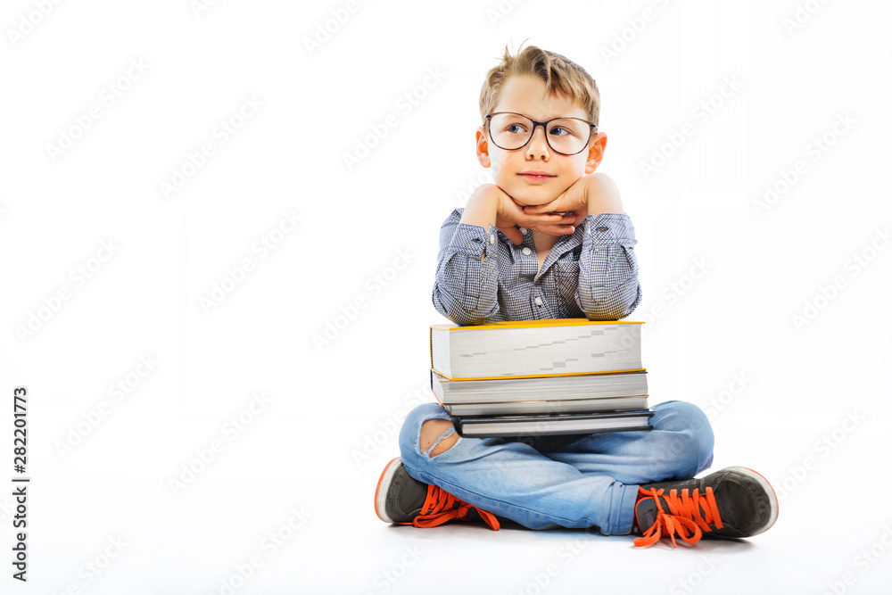 Preschooler with books ready for school