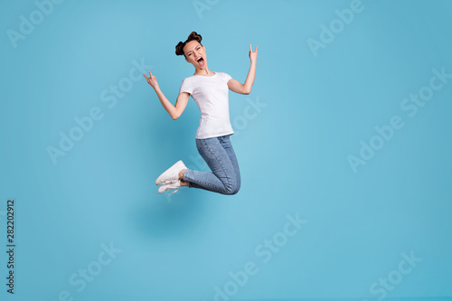 Full length photo of crazy lady yelling loud favorite metal music wear white casual t-shirt jeans denim isolated blue background