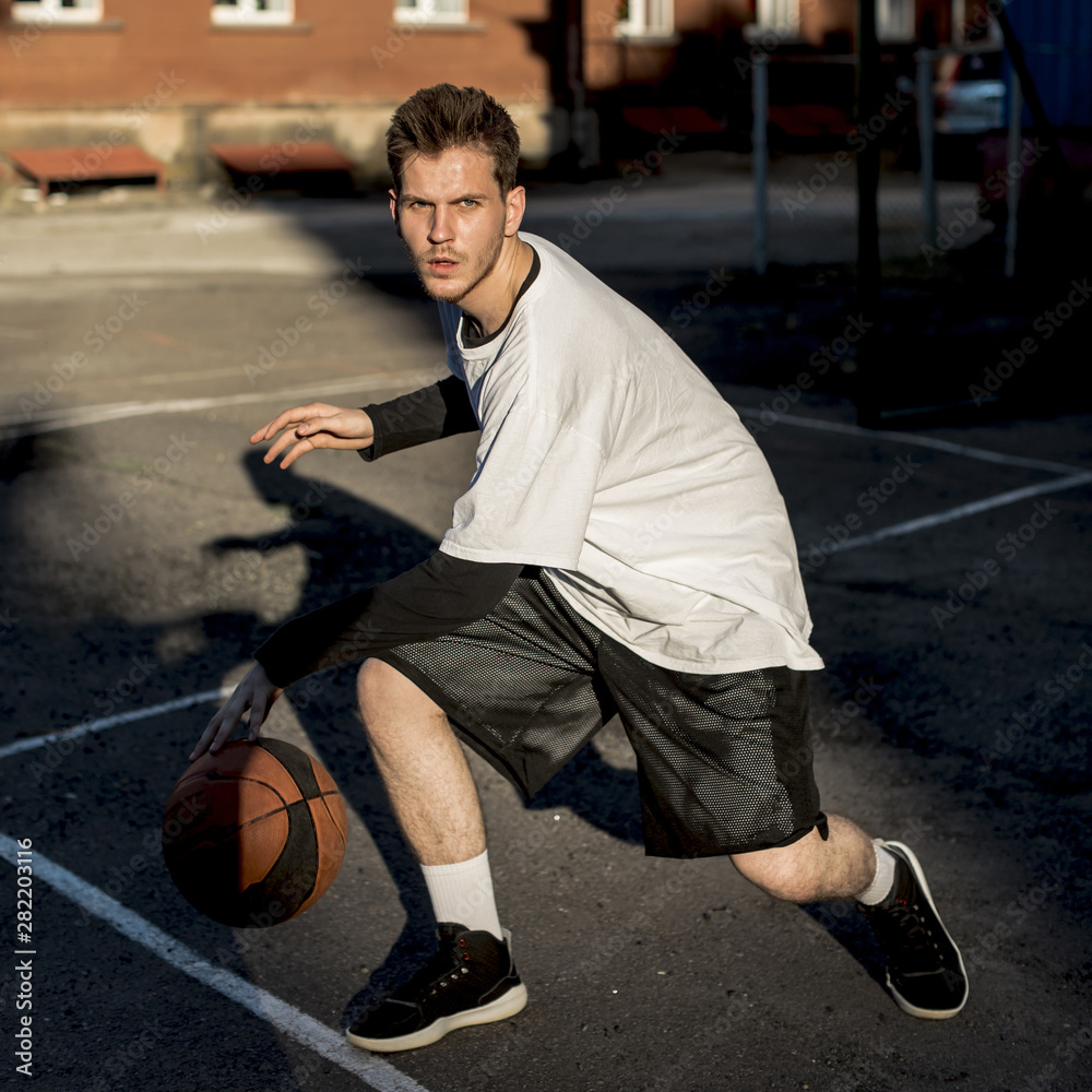 Front view man playing basketball