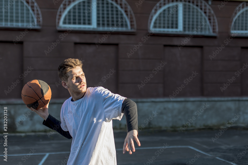 Medium shot man throwing a basketball Medium shot man throwing a basketball