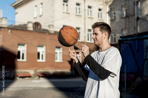 Basketball player spinning ball on his finger