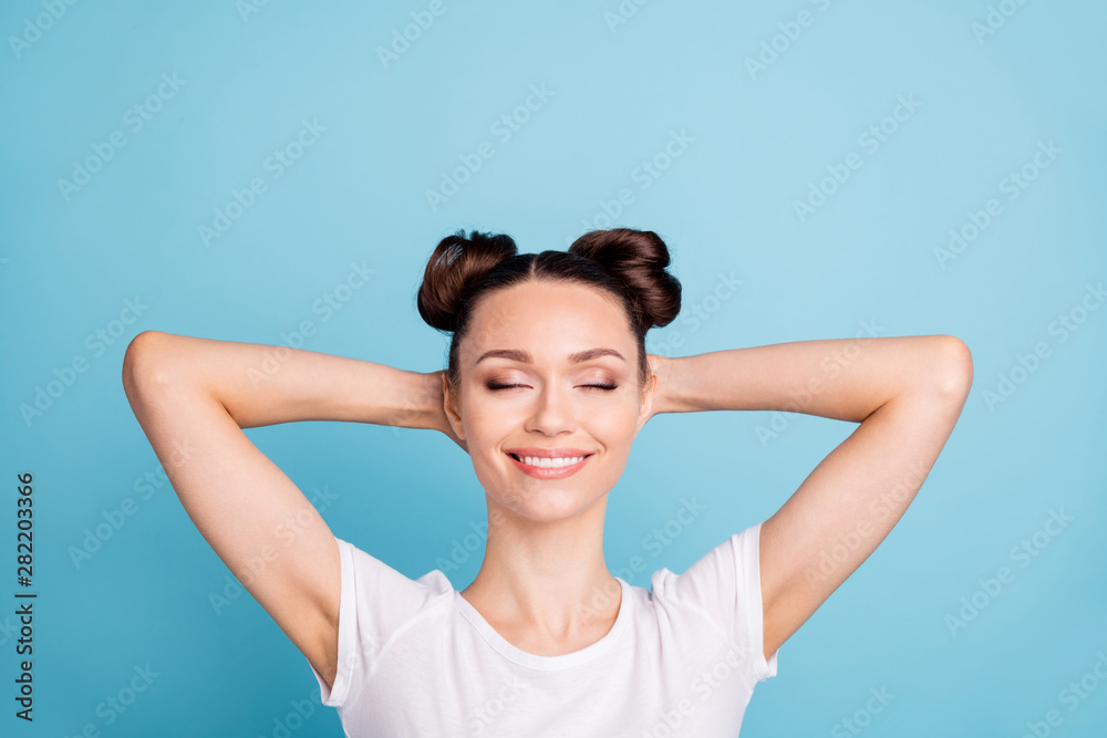 Photo of overjoyed lady holding behind head eyes closed wear white casual t-shirt isolated blue background Photo of overjoyed lady holding behind head eyes closed wear white casual t-shirt isolated blue background