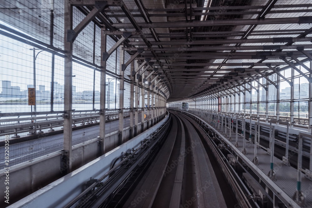 tunnel of monorail road view from front window of a moving train running