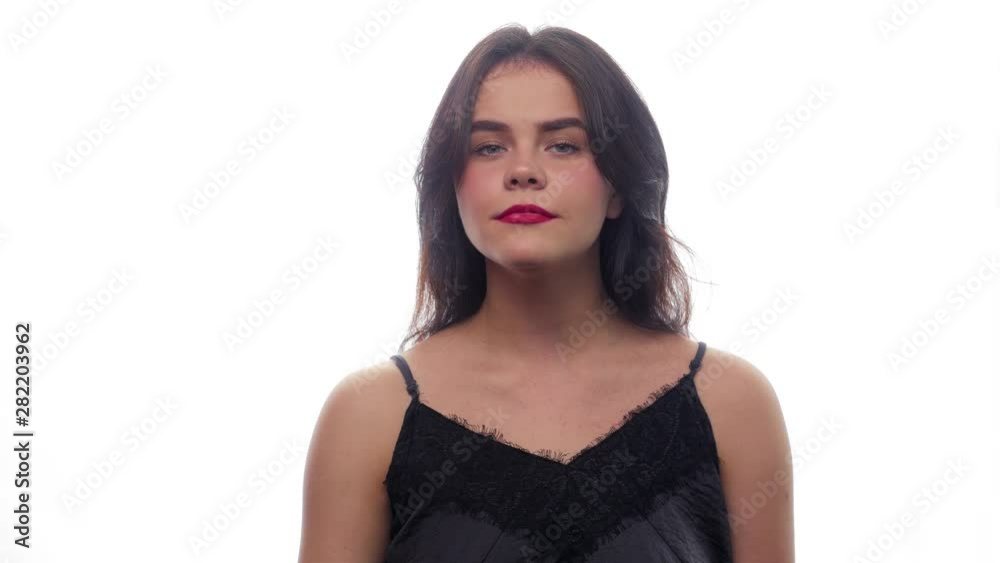 Beautiful girl shows STOP - White background - Face expressions Beautiful girl shows STOP - White background - Face expressions