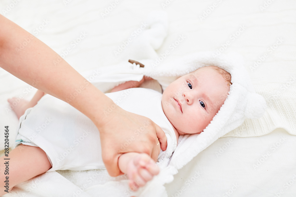 Man changes the diapers of baby Man changes the diapers of baby