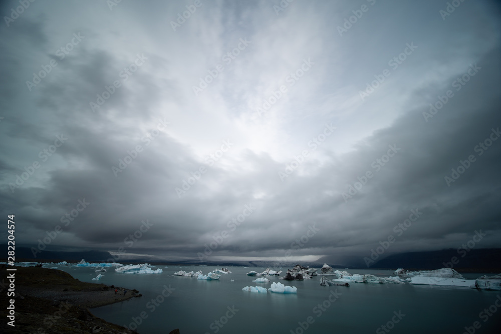 Fototapeta premium Fragments of iceberg in sea water. Iceland north sea