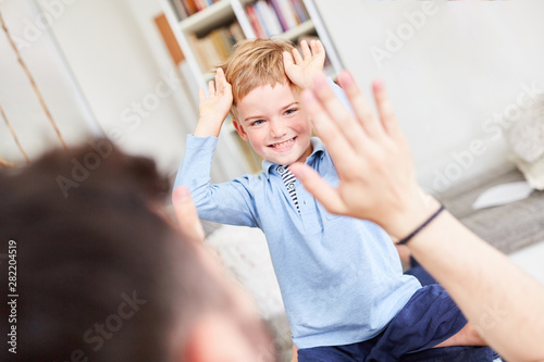 Boy plays with his father