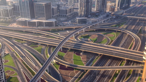 Aerial morning view of highway interchange in Dubai downtown timelapse.