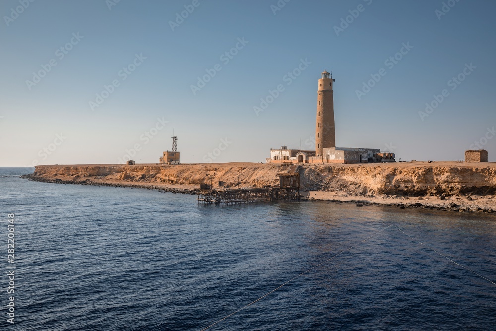 Tall lighthouse on the sea