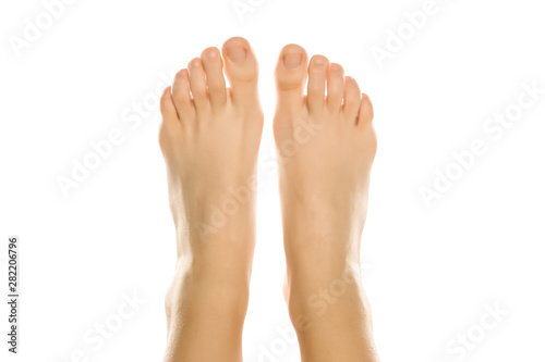 Vászonkép Young woman's beautiful bare feet and toes top view
