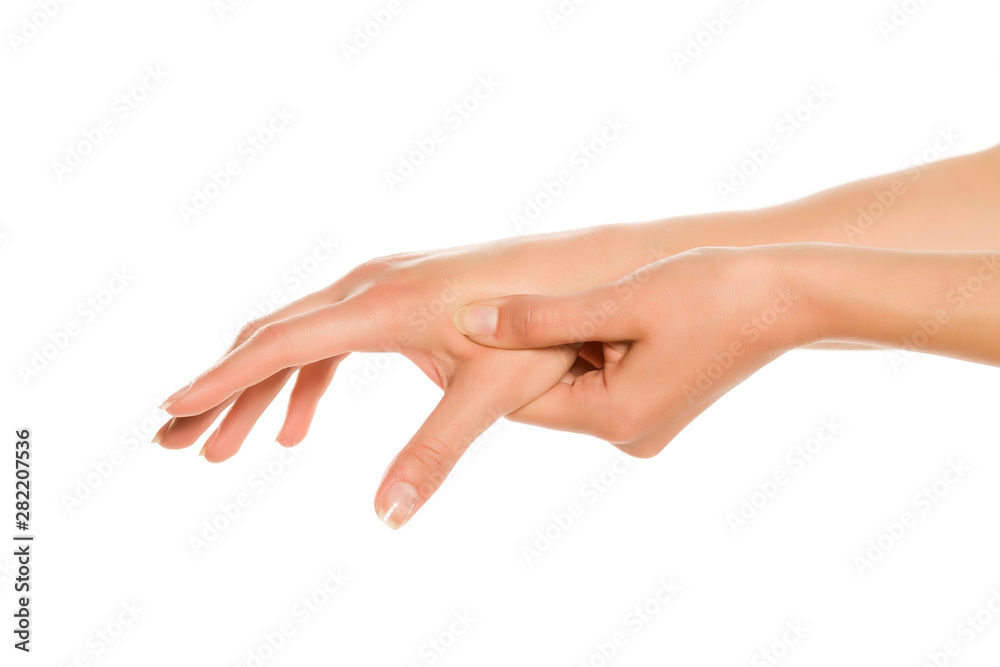 Young woman showing her hand, fingers and massage point. Closeup isolated on white background.