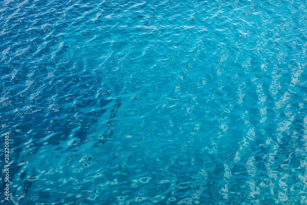 Blue sea surface with transparent shallow water Blue sea surface with transparent shallow water