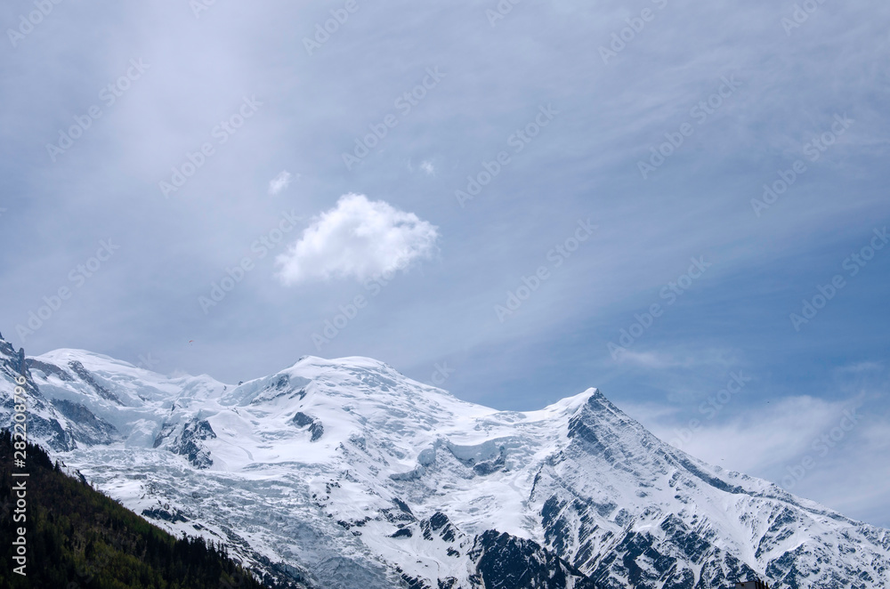 Air view. Beautiful dramatic cloudy sky , mountains and snow peaks. Mont Blanc. Chamonix. France Air view. Beautiful dramatic cloudy sky , mountains and snow peaks. Mont Blanc. Chamonix. France