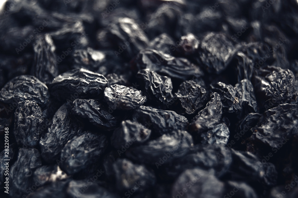 Macro photo of tasty organic black raisins. Macro photo of tasty organic black raisins.