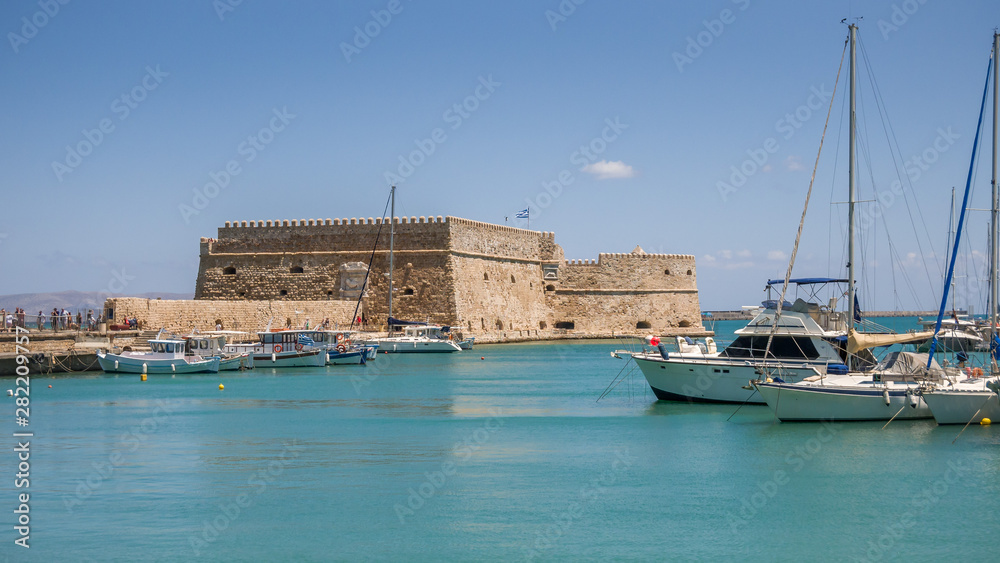 View on a Rocca a Mare fortress and port with boats in Heraklion, Crete island, Greece