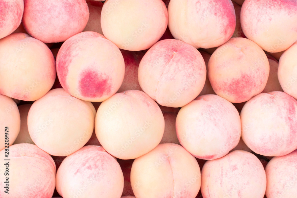 Beautiful large peaches close-up. Background of peaches. Beautiful large peaches close-up. Background of peaches.